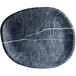 A white melamine oblong platter with a black and white marbled surface.
