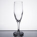 A Libbey clear wine flute with a small rim on top.
