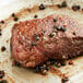 A piece of steak with Regal Gourmet Peppercorn Medley on it.
