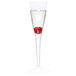A WNA Comet clear plastic champagne glass with a raspberry in it.