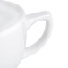 A close-up of a CAC white porcelain cappuccino cup.