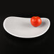 A tomato on an Elite Global Solutions gray speckle triangle melamine plate.