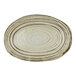 An oval white melamine tray with a black speckled design in the shape of a beach.