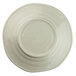 A white Elite Global Solutions melamine plate with a round rim decorated with a beach design.