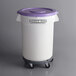 A white Baker's Mark container with a purple lid and black wheels.