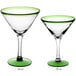 Two Acopa martini glasses with green rims.