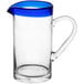 An Acopa glass pitcher with a blue rim and handle.