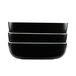 A stack of three rectangular black melamine bowls with a white line on the edge.