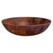 A round bamboo melamine bowl with a checkered pattern.