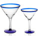 Two Acopa martini glasses with clear bowls and blue rims and bases.