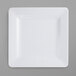 A white square plate with a pebble texture.