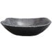 A black Elite Global Solutions rectangular melamine serving bowl with a gray stone base.