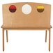 A Whitney Brothers wooden desk for children with three porthole circles on the front.