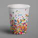 A Creative Converting paper hot cup with sprinkles on it.