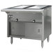 An Eagle Group Spec Master hot food table with two sliding doors over stainless steel pans.