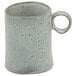 A close up of a blue speckled 10 Strawberry Street Firenza mug with a handle.