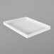 A white rectangular Elite Global Solutions melamine food pan on a gray surface.