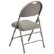 A Flash Furniture gray metal folding chair with a padded vinyl seat and backrest.
