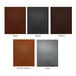 A group of H. Risch Inc. Tamarac menu covers in brown, black, and grey leather with white borders.