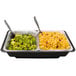 Two Sterno SpeedHeat flameless food warming trays on a counter with food and spoons.