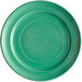 A close-up of a Tuxton Concentrix Cilantro China plate with a spiral pattern in green.