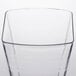 A clear plastic tumbler with a wavy edge.