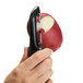 A person using an OXO straight stainless steel vegetable peeler to peel a potato.
