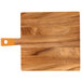 A wooden square serving board with an orange handle.