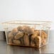 A plastic Cambro food storage container filled with potatoes.