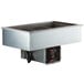 A Delfield drop-in refrigerated cold food well with three pans in a stainless steel base on a counter.