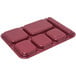 A dark cranberry Carlisle melamine tray with 6 compartments.