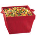 A red Tablecraft square bowl with food in it.