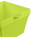 A lime green square cast aluminum container with a lid.