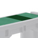 A green rectangular Cambro Versa well cover over two white trays.