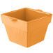 A Tablecraft orange square cast aluminum bowl with a lid.