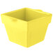 A yellow square cast aluminum container with a lid.