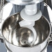 A Vollrath commercial floor mixer with a spiral dough hook inside.