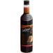 A bottle of DaVinci Gourmet Classic German Chocolate Cake flavoring syrup with a label.