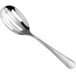 An Acopa stainless steel slotted spoon with a slotted handle.