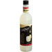 A close up of a bottle of DaVinci Gourmet Classic Pina Colada flavoring syrup with a black cap.