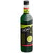 A close up of a bottle of DaVinci Gourmet Classic Lime Fruit Syrup with a lime slice on the side.