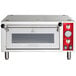 A silver rectangular countertop pizza oven with red knobs and a red handle.