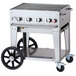 A Crown Verity natural gas grill on a cart with wheels and a lid.