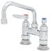 A chrome T&S deck-mounted pantry faucet with two blue handles.