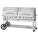 A large silver Crown Verity portable grill with wheels.