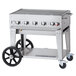 A Crown Verity liquid propane mobile outdoor grill on a cart.