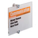 A clear Durable acrylic sign with black text and orange letters on a white background.