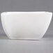 An American Metalcraft white square porcelain bowl with a handle.