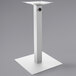 A white square table base with a metal post.