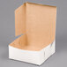 A white cake box with an open lid.
